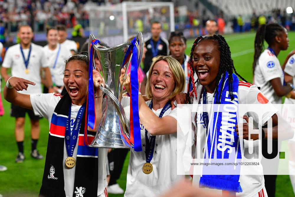 FC Barcelona, Barca v Olympique Lyon, UEFA Women?s Champions League final, football, Turin, Italy Turin, Italy. 21st, May 2022. Head caoch Sonia Bompastor of Olympique Lyon seen with the Champions League trophy celebrating the victory with Melvine Malard (R) and Selma Bacha (L) after the UEFA Women?s Champions League final between Barcelona and Olympique Lyon at Juventus Stadium in Turin. Turin Italy