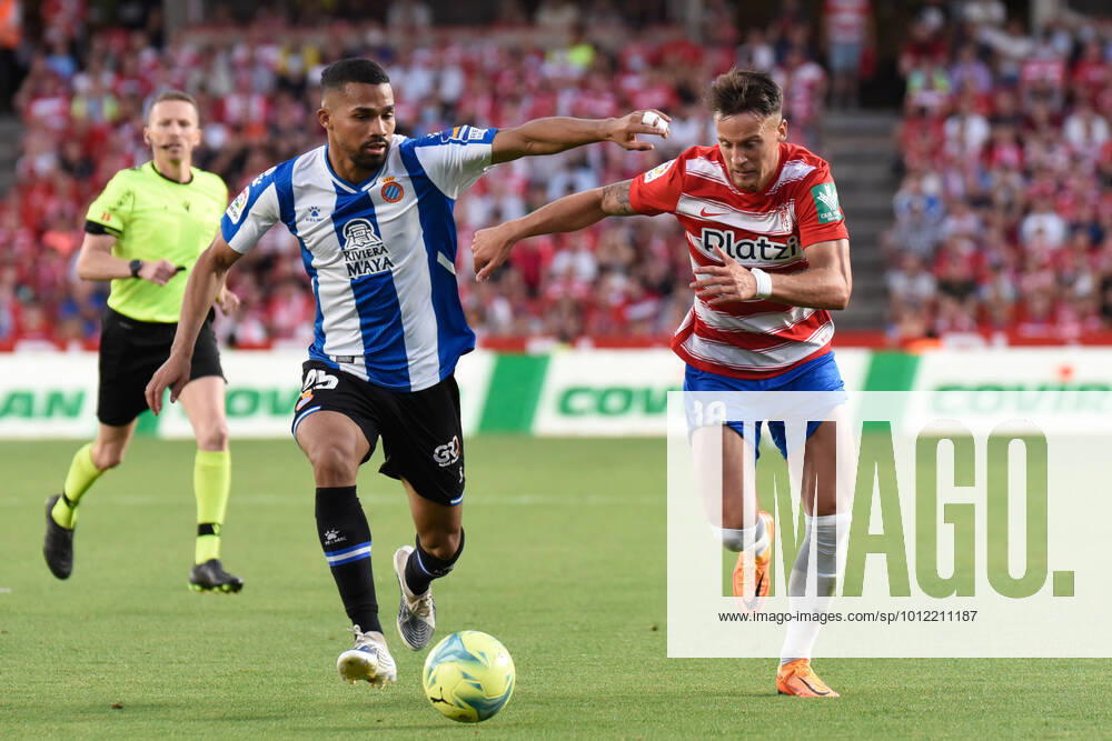 Spain: La Liga-Granada vs RCD Espanol Njegos Petrovic of Granada CF competes for the ball with Yangel Herrera of RCD Espanol during the Liga match between Granada CF and RCD Espanol at Nuevo Los Carmenes Stadium on May 10, 2022 in Granada, Spain. Granada Granada Spain