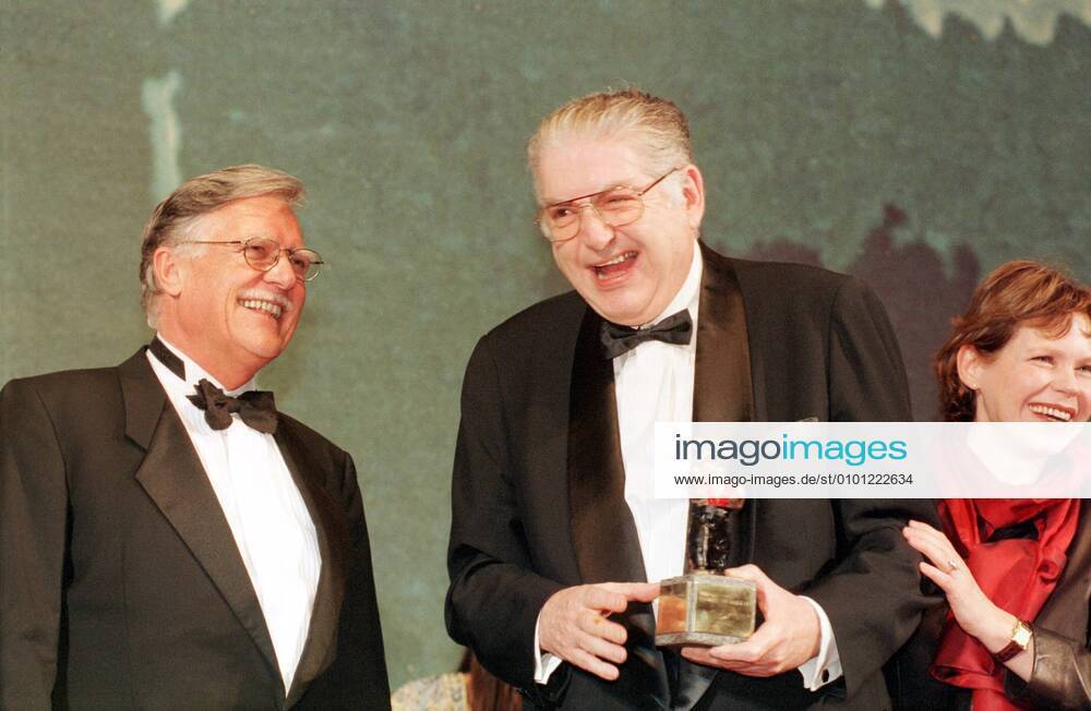 1 Berlinale 99 Festival Director Moritz de Hadeln receives a Suspender Bear from Michael Ballhaus Renate Krössner, as a prize for 20 y