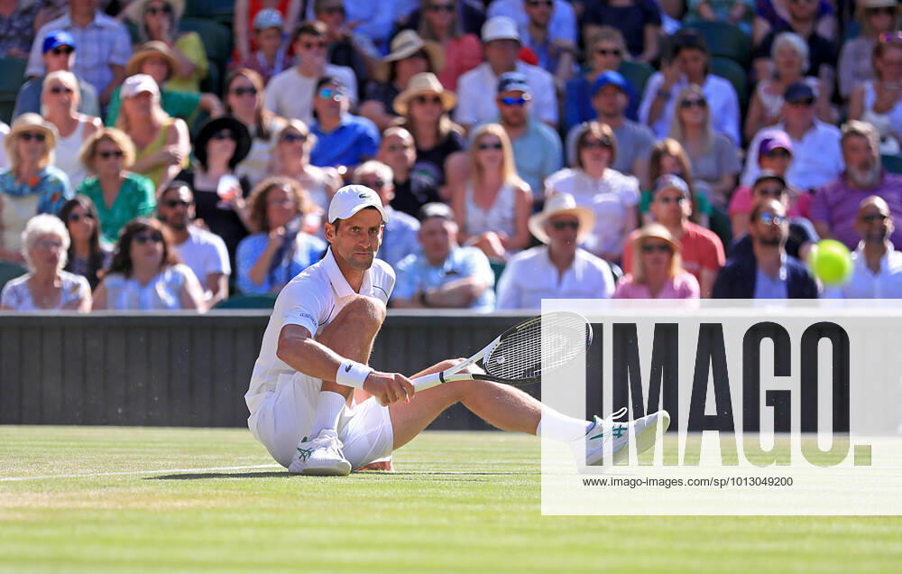 (220709) -- LONDON, July 9, 2022 -- Novak Djokovic of Serbia falls during the men s singles semifinal match against Cameron Norrie of Great Britain at Wimbledon Tennis Championship in London, Britain, on July 8, 2022. ) (SP)BRITAIN-LONDON-TENNIS-WIMBLEDON-MEN S SINGLES-SEMIFINALS LixYing
