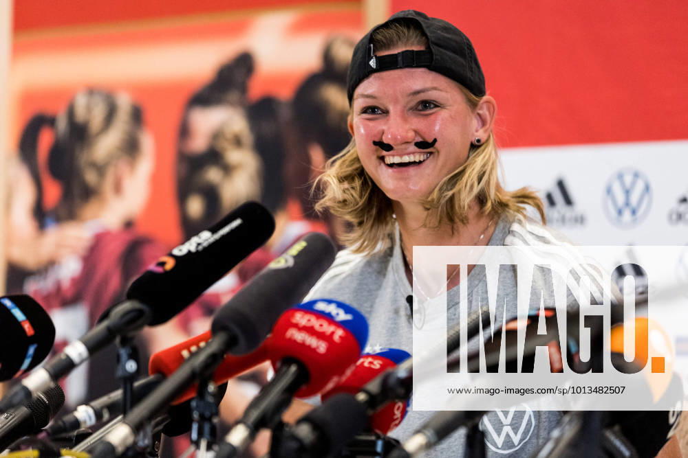 UEFA WOMENS EURO ENGLAND 2022 Press Conference Germany 29 07 2022 Alexandra Popp Germany, 11 with pasted mustache and cap in response to FUMS meme UEFA WOMENS EURO ENGLAND 2022 Press Conference Germany The Grove, London