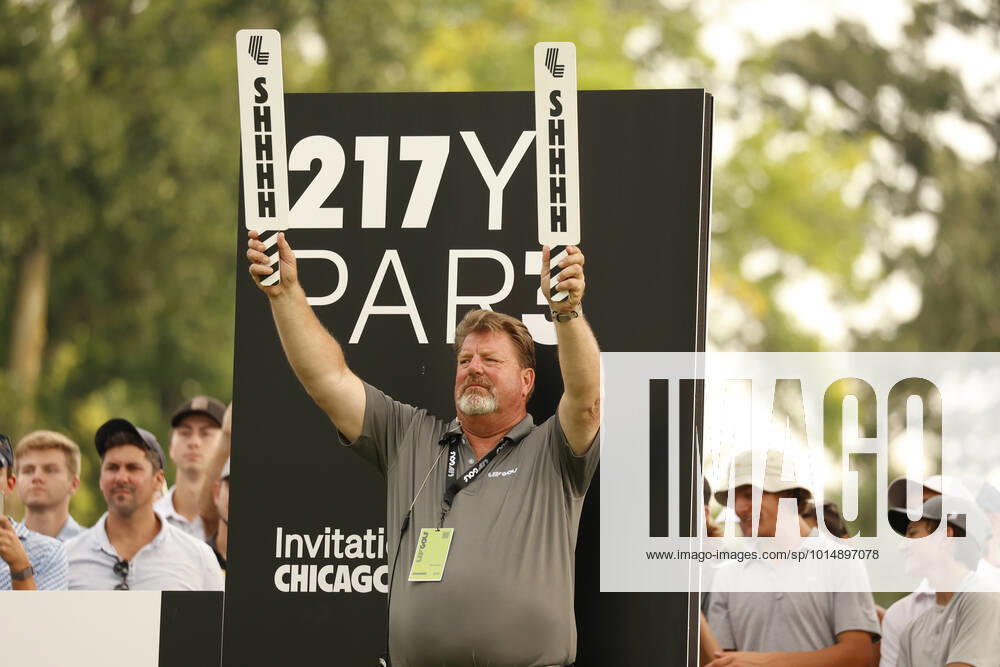 SUGAR GROVE, IL - SEPTEMBER 17: A volunteer holds up signs to be quiet on the 13th tee during the second round of the LIV Golf Invitational Series Chicago on September 17, 2022 at Rich Harvest Farms in Sugar Grove, Illinois. (Photo by Brian Spurlock Icon Sportswire) GOLF: SEP 17 LIV Golf Invitational Series Chicago Icon220917195
