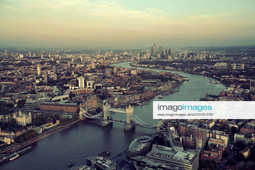 London rooftop view panorama at sunset with urban architectures and Thames River. 202823104694452228