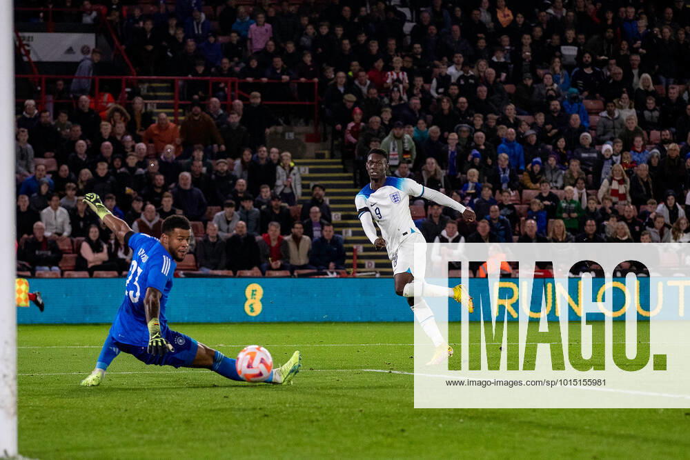 Noah Atubolu (23) saves from Folarin Baogun (9) of England during the International Friendly, Länderspiel, Nationalmannschaft match between England U-21 and Germany U-21 at Bramall Lane, Sheffield, England on 27 September 2022.