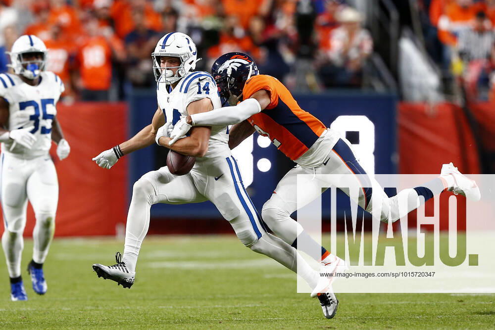 DENVER, CO - OCTOBER 06: Denver Broncos Cornerback Pat Surtain (2) strips the ball form Indianapolis Colts Wide Receiver Alec Pierce (14) during and NFL, American Football Herren, USA game between the Indianapolis Colts and the Denver Broncos on October 06, 2022 at Empower Field at Mile High in Denver CO. (Photo by Jeffrey Brown Icon Sportswire) NFL: OCT 06 Colts at Broncos Icon100622004