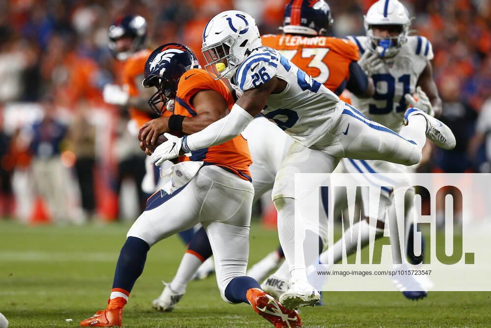 DENVER, CO - OCTOBER 06: Denver Broncos Quarterback Russell Wilson (3) ducks under the rushing Indianapolis Colts Safety Rodney McLeod (26) during and NFL, American Football Herren, USA game between the Indianapolis Colts and the Denver Broncos on October 06, 2022 at Empower Field at Mile High in Denver CO. (Photo by Jeffrey Brown Icon Sportswire) NFL: OCT 06 Colts at Broncos Icon100622012