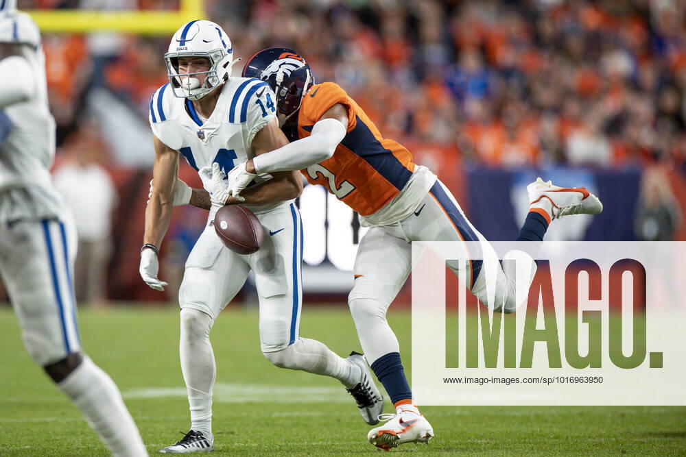 DENVER, CO - OCTOBER 06: Denver Broncos cornerback Pat Surtain II hits the ball causing a fumble by Indianapolis Colts wide receiver Alec Pierce (14) in the first half of an NFL, American Football Herren, USA game between the Indianapolis Colts and the Denver Broncos at Empower Field at Mile High on October 06, 2022 in Denver, Colorado. (Photo by Brandon Sloter Icon Sportswire) NFL: OCT 06 Colts at Broncos Icon221006139