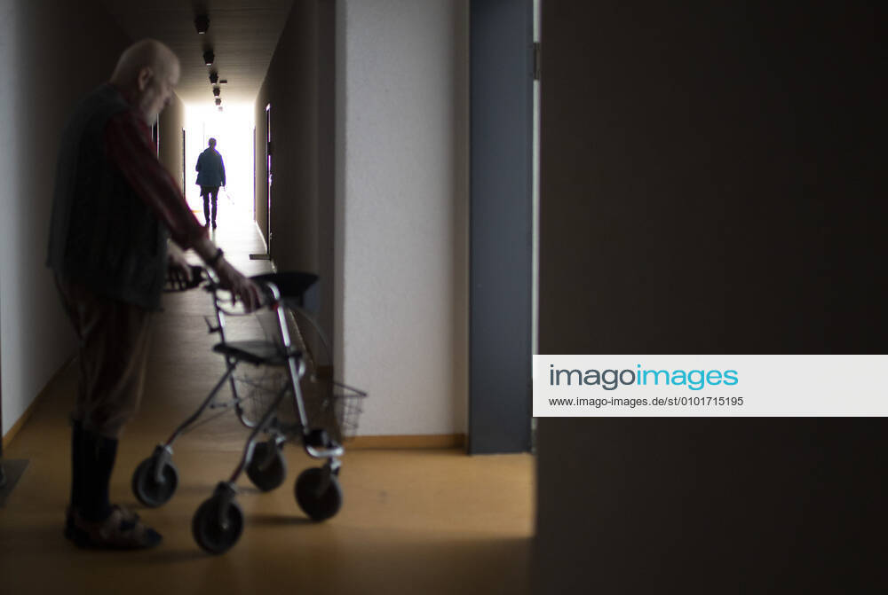 Theme Man with walker in a dark hallway Heidelberg Germany