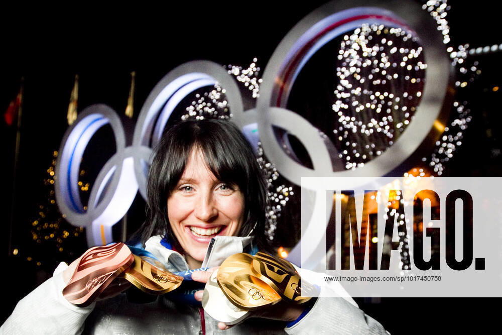 VANCOUVER, WHISTLER, CANADA 20100228 Marit Bjorgen with all the medals she won in cross country skiing in Whistler Olympic Park during the Olympics in Vancouver 2010 Three gold relay, skiathlon, Team Sprint , a silver in the 30 km and a bronze in the 10 km VANCOUVER, WHISTLER CANADA