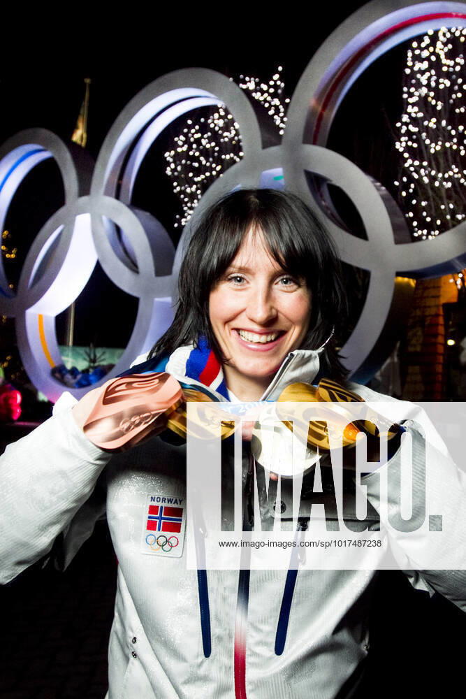 VANCOUVER, WHISTLER, CANADA 20100228 Marit Bjorgen with all the medals she won in cross country skiing in Whistler Olympic Park during the Olympics in Vancouver 2010 Three gold relay, skiathlon, Team Sprint , a silver in the 30 km and a bronze in the 10 km VANCOUVER, WHISTLER CANADA