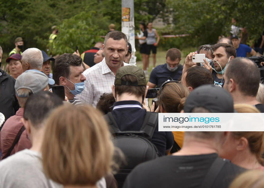 Mayor of Kiev Vitali Klitschko (C back) talks to people at the scene of a gas explosion in a block of flats at Hryhorenko Street in Darnytskyi District of Kiev. At least two people died in the blast, which destroyed several flats on four floors. Sergei Plachkov TASS TS0DD659