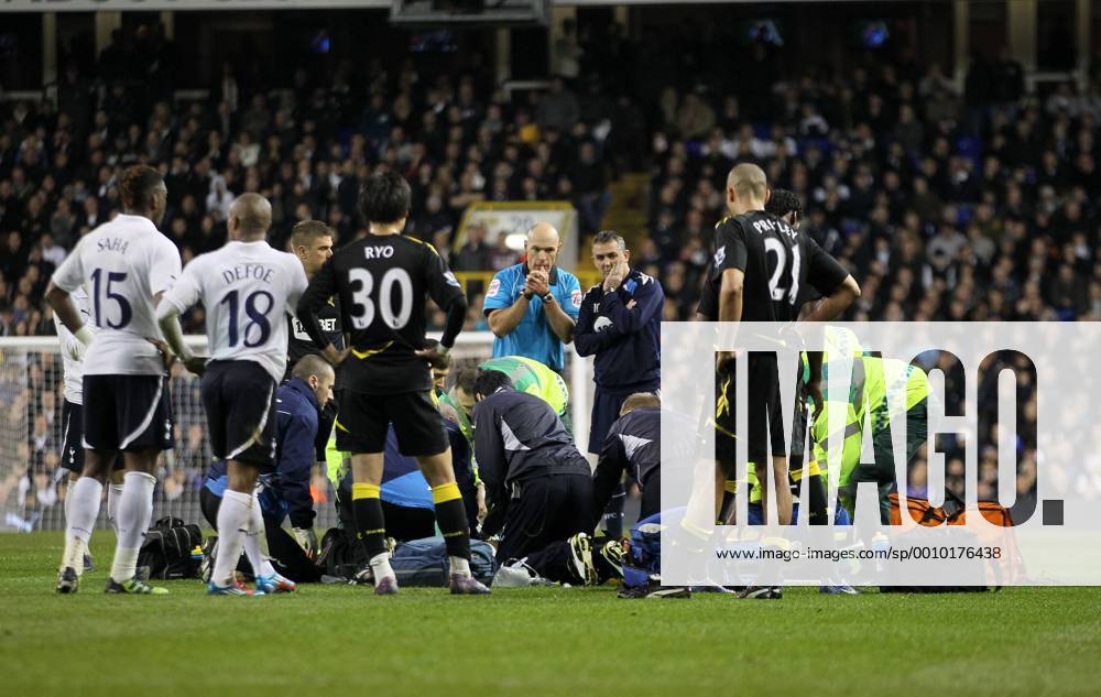 Referee Howard Webb and Bolton manager Owen Coyle look on in shock as Fabrice Muamba collapses Tottenham v Bolton, FA Cup Quarter Final sponsored by Budweiser, at White Hart Lane, London. 17th March 2012 .