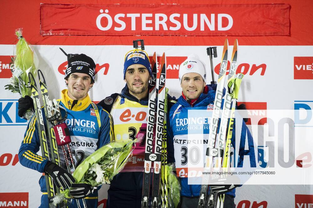 ÖSTERSUND 2013 11 30 From left Swedens Fredrik Lindström, second, Frances Martin Fourcade, winner, USAs Tim Burke, third, celebrate on the podium after the mens 10-kilometre sprint at the World Cup biathlon in Östersund, Sweden