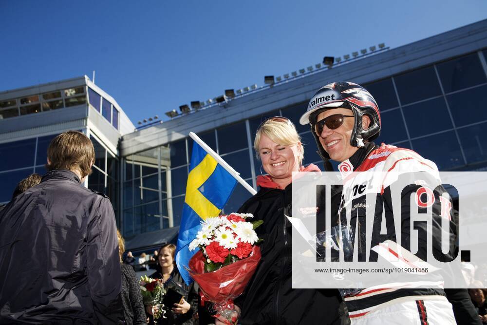 GÖTEBORG 20090418 Curling skipper and Olympic gold medallist Anette Norberg congratulates coach Örjan Kihlström after winning the Olympic race with the horse Triton Sund at the Aby trotting track in Gothenburg on Saturday GÖTEBORG SWEDEN