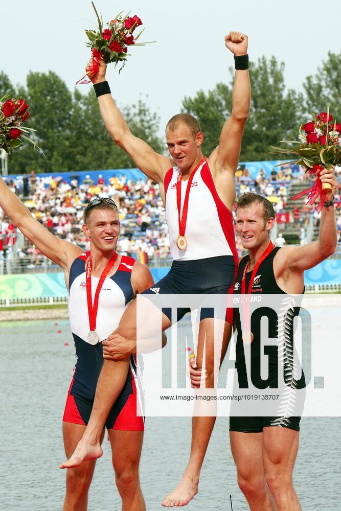 BEIJING, CHINA 20080816 Norway s Olaf Tufte C is lifted by Czech Republic s Ondrej Synek L and New Zealand s Mahe Drysdale during the medals during the medal ceremony for the men s single sculls final at the Shunyi Rowing and Canoeing Park during the 2008 Beijing Olympic Games in Beijing on August 16, 2008 BEIJING CHINA PICTURES