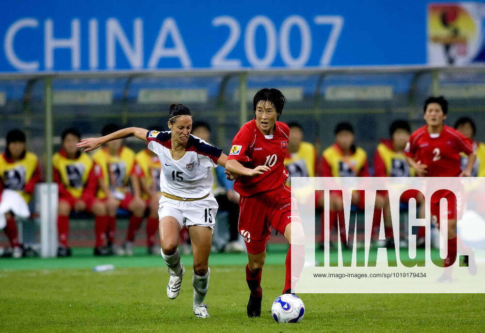 CHENGDU 20070911 Womens Football World Cup Group Stage 1, Chengdu USA vs North Korea USAs No.15 Kate Markgraf in a duel with North Koreas No.10 Ri Kum Suk CHENGDU CHINA