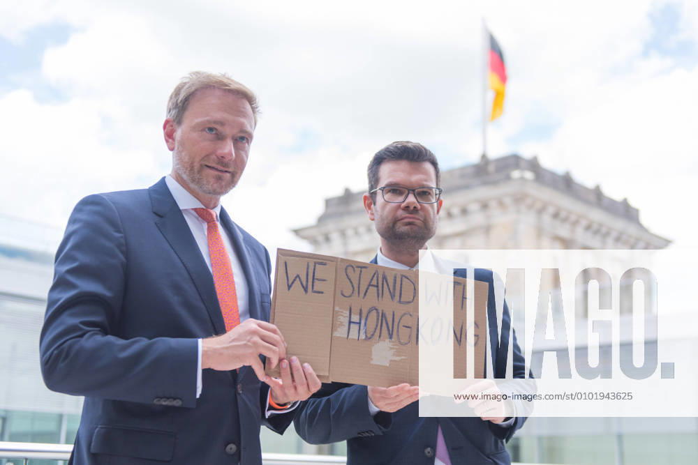 Berlin, Press Conference FDP Faction Germany, Berlin 30 06 2020 In the picture Christian Lindner Federal Chairman FDP and Marco Buschmann FDP can be seen with a WE STAND WITH HONGKONG sign in the German Bundestag before the press conference of the Faction Berlin Bundestag Berlin Germany