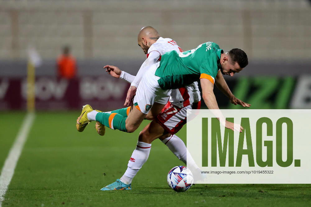 Alan Browne (front) of Ireland is challenged by Teddy Teuma (back) of Malta during the international soccer match between Malta and Ireland at the National Stadium, Malta on November 20, 2022 (Photo by Domenic Aquilina) Malta v Ireland - International Soccer Friendlzy A