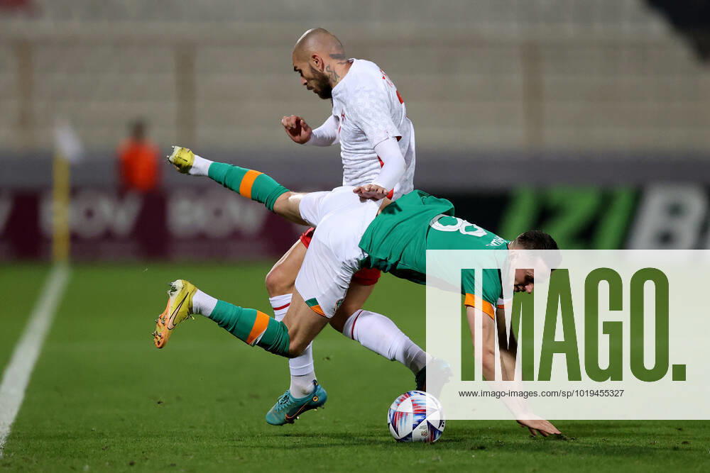 Alan Browne (front) of Ireland is challenged by Teddy Teuma (back) of Malta during the international soccer match between Malta and Ireland at the National Stadium, Malta on November 20, 2022 (Photo by Domenic Aquilina) Malta v Ireland - International Soccer Friendlzy A