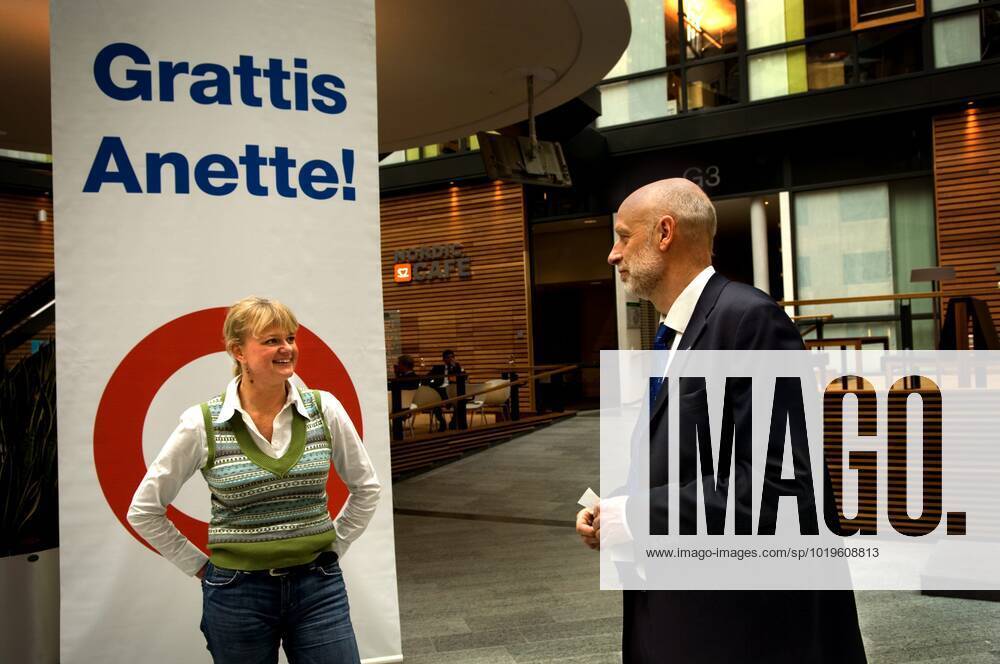 STOCKHOLM 20060228 The Olympic party is over and gold hero Anette Norberg is back home Yesterday she was back at work at Nordea where she was honoured by her colleague Magnus Erkander, head of finance at Nordea STOCKHOLM SWEDEN