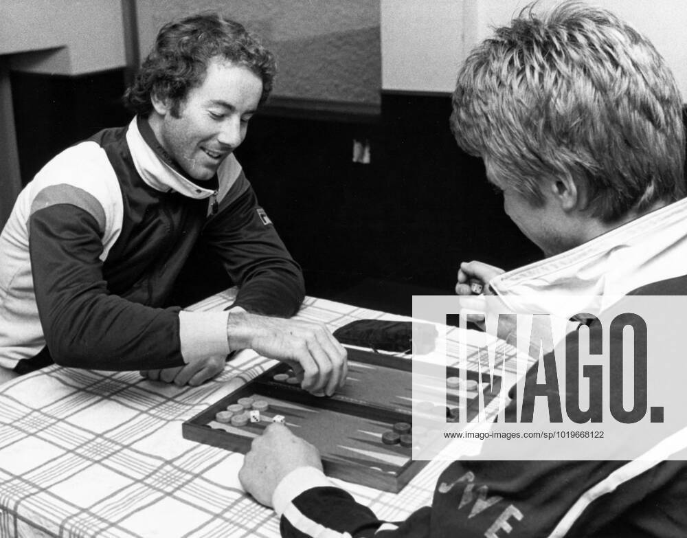 Madonna di Campiglio 1978 12 01 Ingemar Stenmark and Stig Strand pass the time playing backgammon in a rainy Madonna di Campiglio Madonna di Campiglio Italy
