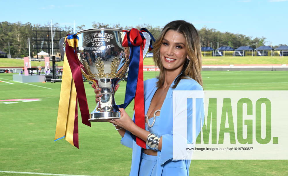AFLW ENTERTAINMENT MEDIA CALL, Performer Delta Goodrem is seen holding the AFLW Premiership Cup during a 2022 AFLW Grand Final Pre-Match entertainment media preview at Brighton Homes Arena, in Brisbane, Friday, November 25, 2022. The Lions will play Melbourne in the AFLW Grand Final on Sunday in Brisbane. ( NO ARCHIVING, , NO USE IN BOOKS WITHOUT CONSENT BRISBANE QUEENSLAND AUSTRALIA