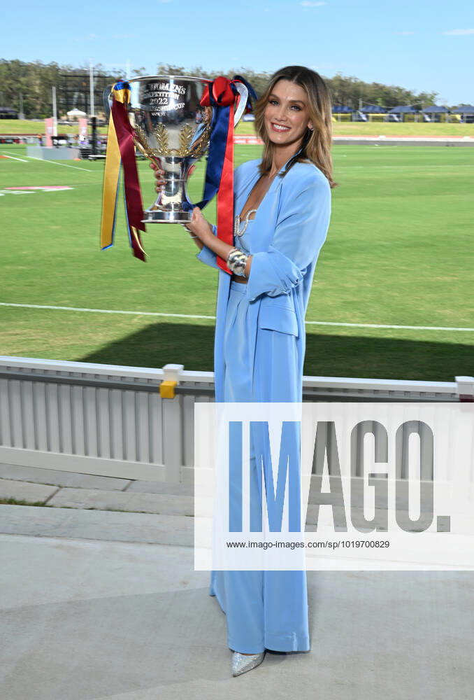 AFLW ENTERTAINMENT MEDIA CALL, Performer Delta Goodrem is seen holding the AFLW Premiership Cup during a 2022 AFLW Grand Final Pre-Match entertainment media preview at Brighton Homes Arena, in Brisbane, Friday, November 25, 2022. The Lions will play Melbourne in the AFLW Grand Final on Sunday in Brisbane. ( NO ARCHIVING, , NO USE IN BOOKS WITHOUT CONSENT BRISBANE QUEENSLAND AUSTRALIA