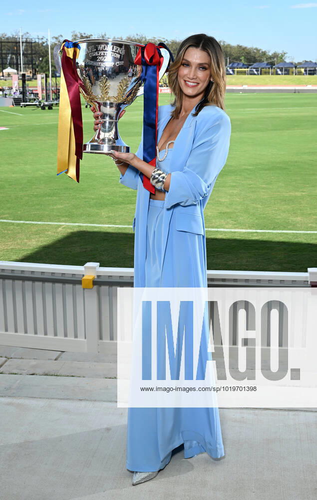 AFLW ENTERTAINMENT MEDIA CALL, Performer Delta Goodrem is seen holding the AFLW Premiership Cup during a 2022 AFLW Grand Final Pre-Match entertainment media preview at Brighton Homes Arena, in Brisbane, Friday, November 25, 2022. The Lions will play Melbourne in the AFLW Grand Final on Sunday in Brisbane. ( NO ARCHIVING, , NO USE IN BOOKS WITHOUT CONSENT BRISBANE QUEENSLAND AUSTRALIA