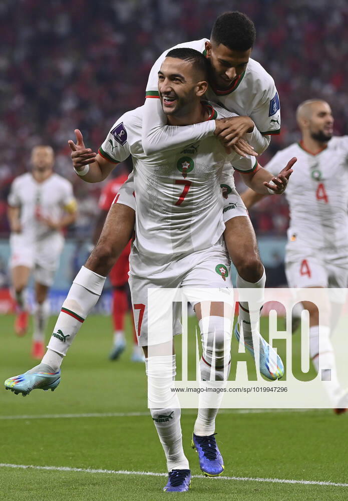 (221201) -- DOHA, Dec. 1, 2022 -- Hakim Ziyech (front) of Morocco celebrates after scoring during the Group F match between Canada and Morocco at the 2022 FIFA World Cup, WM, Weltmeisterschaft, Fussball at Al Thumama Stadium in Doha, Qatar, Dec. 1, 2022. ) (SP)QATAR-DOHA-2022 WORLD CUP-GROUP F-CAN VS MAR ChenxCheng