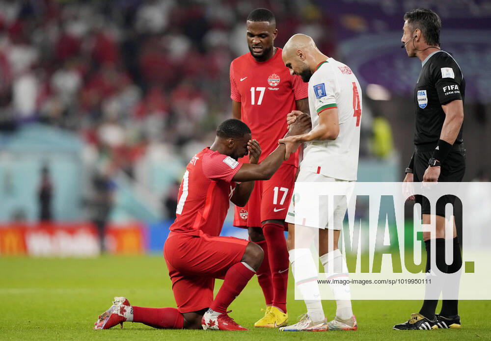Mandatory Credit: Photo by Dave Shopland Shutterstock (13640369cz) Sofyan Amrabat of Morocco helps up Junior Hoilett of Canada. Canada v Morocco, FIFA World Cup, WM, Weltmeisterschaft, Fussball 2022, Group F, Football, Al Thumama Stadium, Doha, Qatar - 01 Dec 2022 Editorial Use Only Canada v Morocco, FIFA World Cup 2022, Group F, Football, Al Thumama Stadium, Doha, Qatar - 01 Dec 2022 Editorial Use Only