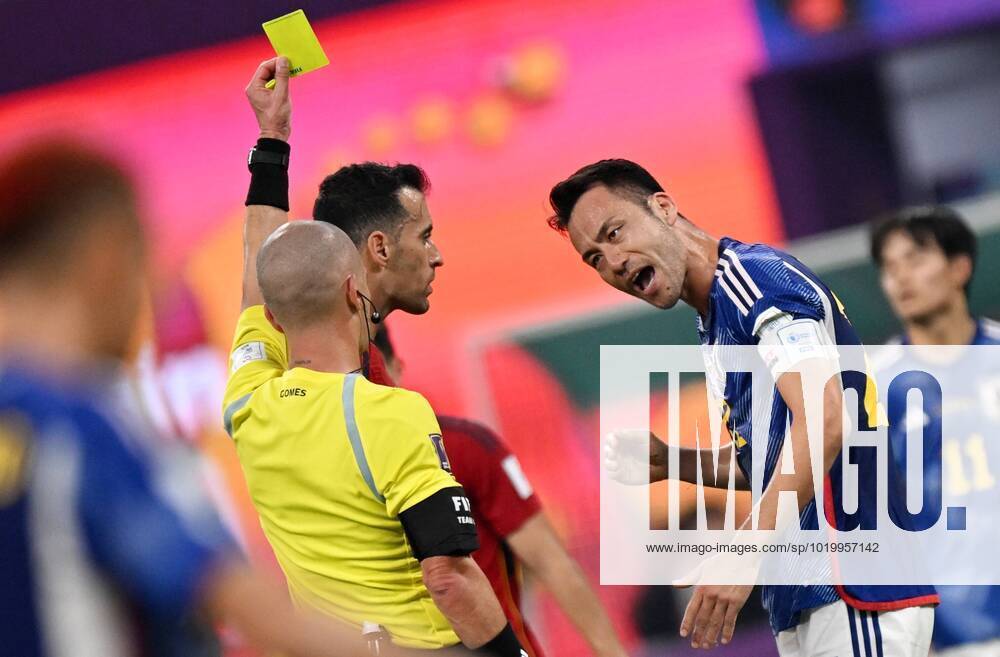 Russia Soccer World Cup Japan - Spain 8329413 01.12.2022 Referee Maya Yoshida shows a yellow card to Japan s during the Qatar 2022 World Cup Group E soccer match between Japan and Spain, in Doha, Qatar. Grigory Sysoev Sputnik Doha Qatar
