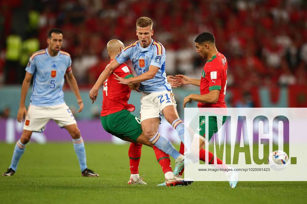 Mandatory Credit: Photo by Michael Zemanek Shutterstock (13651657w) Sofyan Amrabat of Morocco and Achraf Hakimi of Morocco challenge Dani Olmo of Spain. Morocco v Spain, FIFA World Cup, WM, Weltmeisterschaft, Fussball 2022, Round of 16, Football, Education City Stadium, Doha, Qatar - 06 Dec 2022 Editorial Use Only Morocco v Spain, FIFA World Cup 2022, Round of 16, Football, Education City Stadium, Doha, Qatar - 06 Dec 2022 Editorial Use Only