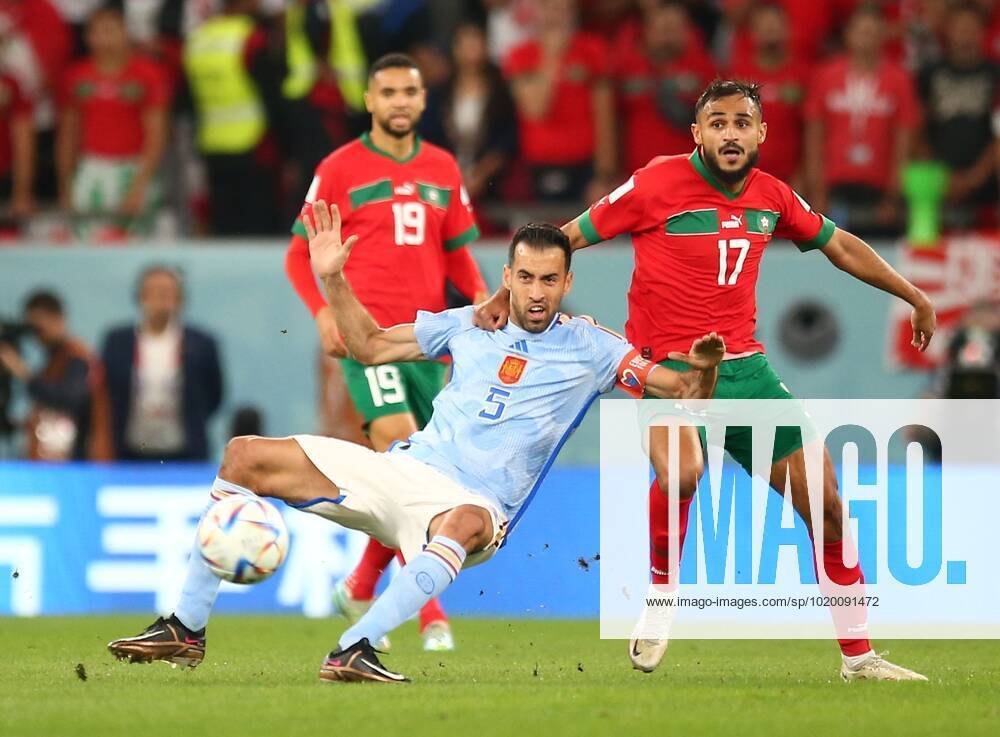 Mandatory Credit: Photo by Michael Zemanek Shutterstock (13651657x) Sofiane Boufal of Morocco challenges Sergio Busquets of Spain but no foul given. Morocco v Spain, FIFA World Cup, WM, Weltmeisterschaft, Fussball 2022, Round of 16, Football, Education City Stadium, Doha, Qatar - 06 Dec 2022 Editorial Use Only Morocco v Spain, FIFA World Cup 2022, Round of 16, Football, Education City Stadium, Doha, Qatar - 06 Dec 2022 Editorial Use Only