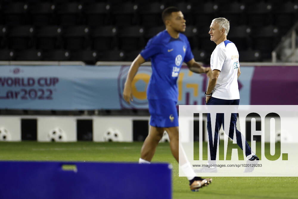 France s striker Kylian Mbappe (L) and head coach Didier Deschamps (R) take part in a training session held at Al Sadd Stadium, in Doha, Qatar, 08 December 2022. France will face England in their FIFA World Cup, WM, Weltmeisterschaft, Fussball 2022 quarter final soccer match on 10 December. France s training session !ACHTUNG: NUR REDAKTIONELLE NUTZUNG!