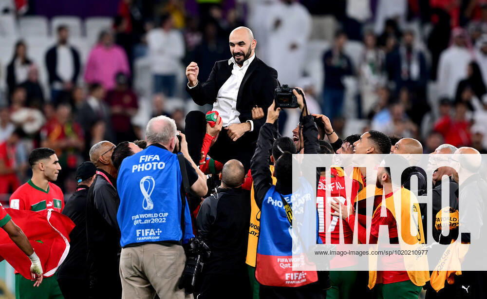 FOOTBALL World Cup 2022 quarterfinals Morocco Portugal 10 12 2022 jubilation after the victory, coach Walid Regragui Morocco is carried on the shoulders of the players.