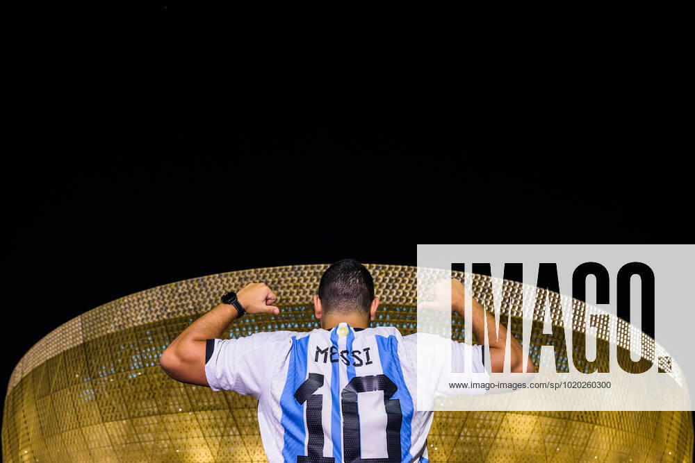 A man with a Lionel Messi jersey poses in front of Lusail Stadium ahead of the FIFA World Cup 2022 semifinal between Argentina and Croatia on December 13, 2022 in Doha Photo Joel Marklund BILDBYRAN code JM JM0411 bbeng football football soccer fotball vm fotbols vm fotball vm soccer world cup 2022 fifa world cup 2022 semi final semi final argentina croatia croatia arena exterior,