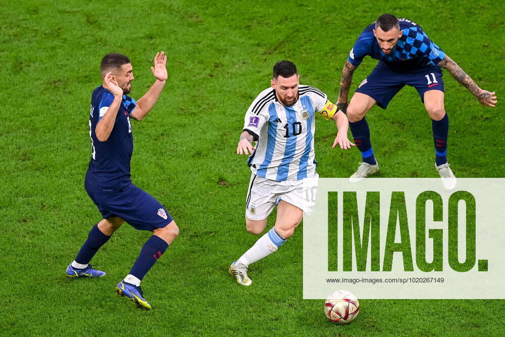 FOOTBALL World Cup 2022 Semifinal Argentina Croatia 13 12 2022 Mateo Kovacic Croatia left , Lionel Messi Argentina center and Marcelo Brozovic Croatia
