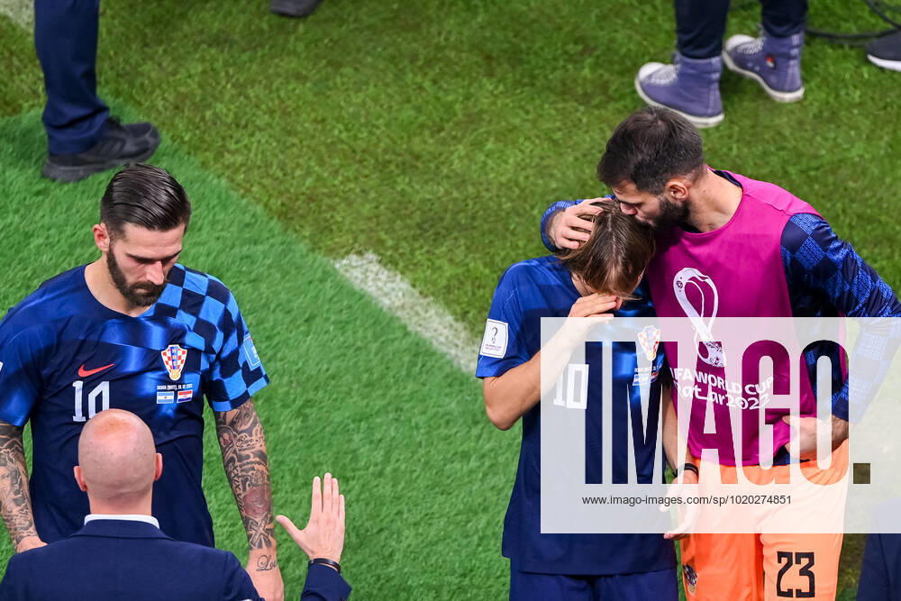 FOOTBALL World Cup 2022 semifinal Argentina Croatia 13 12 2022 Marko Livaja left , Luka Modric center and goalkeeper Ivica Ivusic right all Croatia disappointed