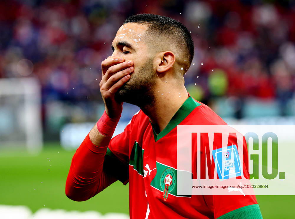 Al Khor, Qatar, 14th December 2022. Hakim Ziyach of Morocco slashes water over his face during the FIFA World Cup, WM, Weltmeisterschaft, Fussball 2022 match at Al Bayt Stadium, Al Khor. Picture credit should read: David Klein Sportimage . SPI-2098-0021