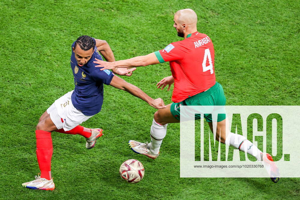 QATAR, AL KHOR - DECEMBER 14, 2022: France s Jules Kounde (L) and Morocco s Sofyan Amrabat in action in their 2022 FIFA World Cup, WM, Weltmeisterschaft, Fussball semi-final football match at Al-Bayt Stadium. Sergei Bobylev TASS 56419892