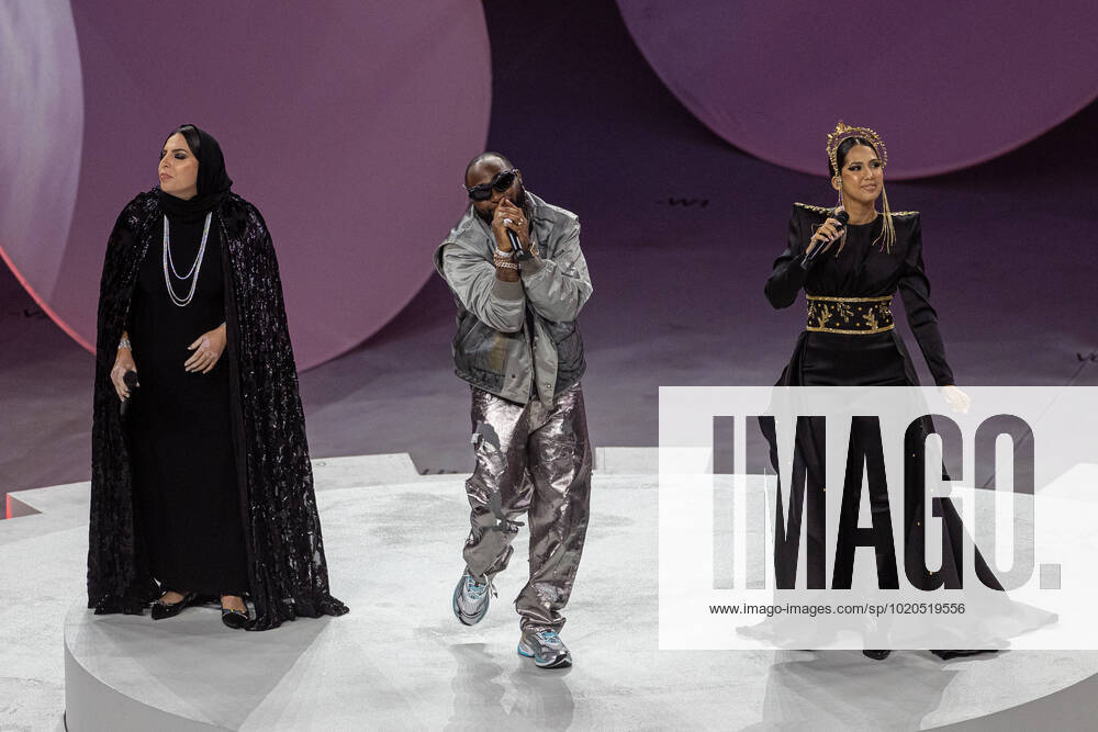 Football - FIFA World Cup, WM, Weltmeisterschaft, Fussball Qatar 2022 - Final - Argentina v France DOHA, QATAR - Sunday, December 18, 2022: Davido (C) and Aisha perform during the closing ceremony before the FIFA World Cup Qatar 2022 Final match between Argentina and France at the Lusail Stadium. AL-DAAYEN Lusail Stadium DOHA QATAR