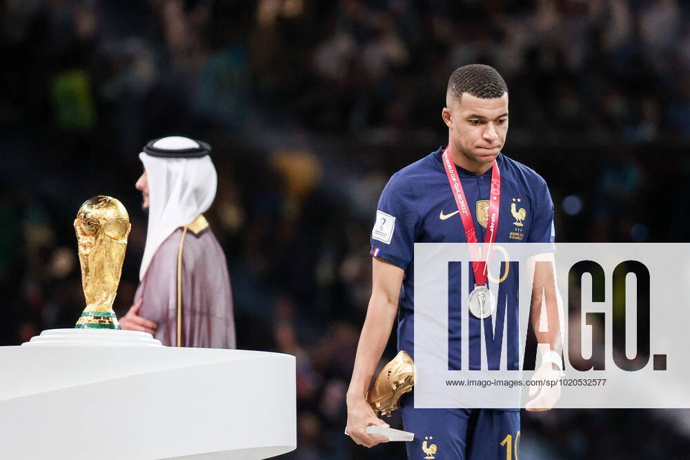 QATAR, LUSAIL - DECEMBER 18, 2022: France captain Kylian Mbappe (R) is seen during the trophy ceremony for the 2022 FIFA World Cup, WM, Weltmeisterschaft, Fussball final football match between Argentina and France at Lusail Iconic Stadium. Argentina won 3-3 (4-2) in a penalty shootout. Sergei Bobylev TASS 56487384