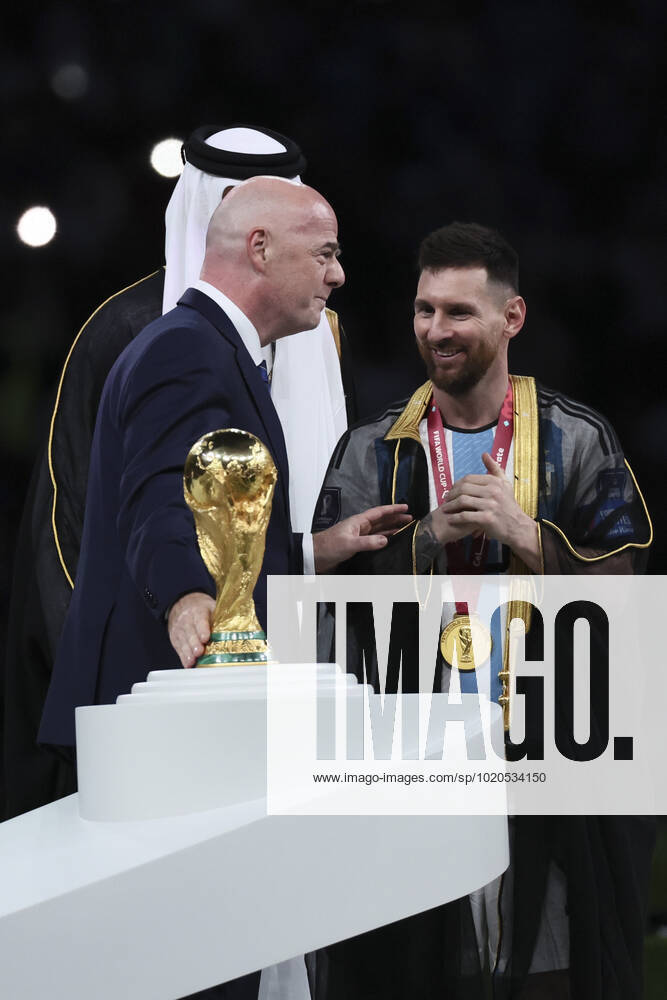 (221218) -- LUSAIL, Dec. 18, 2022 -- FIFA President Gianni Infantino (L) awards Lionel Messi (R) of Argentina during the awarding ceremony of the 2022 FIFA World Cup, WM, Weltmeisterschaft, Fussball at Lusail Stadium in Lusail, Qatar, Dec. 18, 2022. ) (SP)QATAR-LUSAIL-2022 WORLD CUP-FINAL-ARG VS FRA LanxHongguang