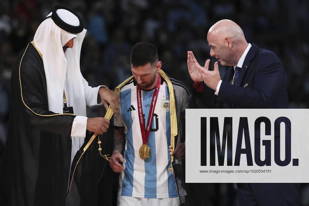 (221218) -- LUSAIL, Dec. 18, 2022 -- FIFA President Gianni Infantino (R) and The Emir of Qatar Sheikh Tamim bin Hamad Al Thani (L) award Lionel Messi of Argentina during the awarding ceremony of the 2022 FIFA World Cup, WM, Weltmeisterschaft, Fussball at Lusail Stadium in Lusail, Qatar, Dec. 18, 2022. ) (SP)QATAR-LUSAIL-2022 WORLD CUP-FINAL-ARG VS FRA LanxHongguang