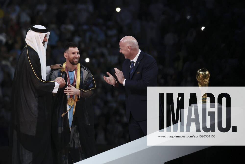 (221218) -- LUSAIL, Dec. 18, 2022 -- FIFA President Gianni Infantino (R) and The Emir of Qatar Sheikh Tamim bin Hamad Al Thani (L) award Lionel Messi of Argentina during the awarding ceremony of the 2022 FIFA World Cup, WM, Weltmeisterschaft, Fussball at Lusail Stadium in Lusail, Qatar, Dec. 18, 2022. ) (SP)QATAR-LUSAIL-2022 WORLD CUP-FINAL-ARG VS FRA LanxHongguang