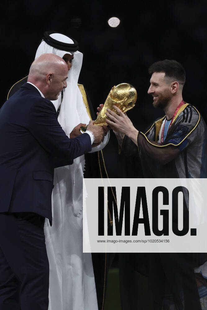 (221218) -- LUSAIL, Dec. 18, 2022 -- FIFA President Gianni Infantino (L) awards Lionel Messi (R) of Argentina during the awarding ceremony of the 2022 FIFA World Cup, WM, Weltmeisterschaft, Fussball at Lusail Stadium in Lusail, Qatar, Dec. 18, 2022. ) (SP)QATAR-LUSAIL-2022 WORLD CUP-FINAL-ARG VS FRA LanxHongguang