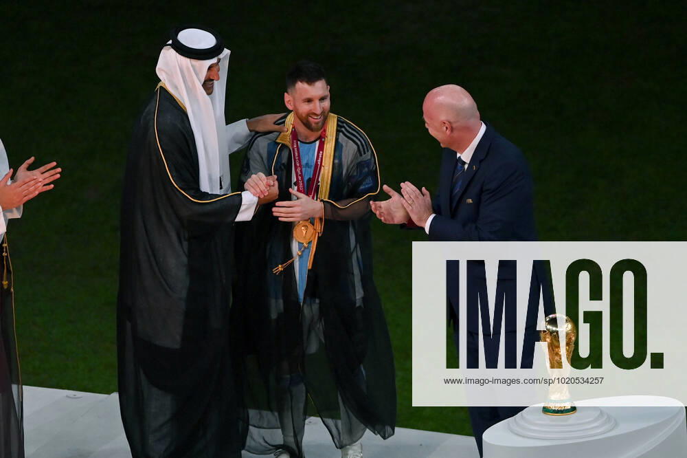 FOOTBALL World Cup 2022 Final Argentina France 18 12 2022 Tamim bin Hamad Al Thani Emir of Qatar puts a cape Bischt around Lionel Messi Fifa President Gianni Infantino shows great enthusiasm