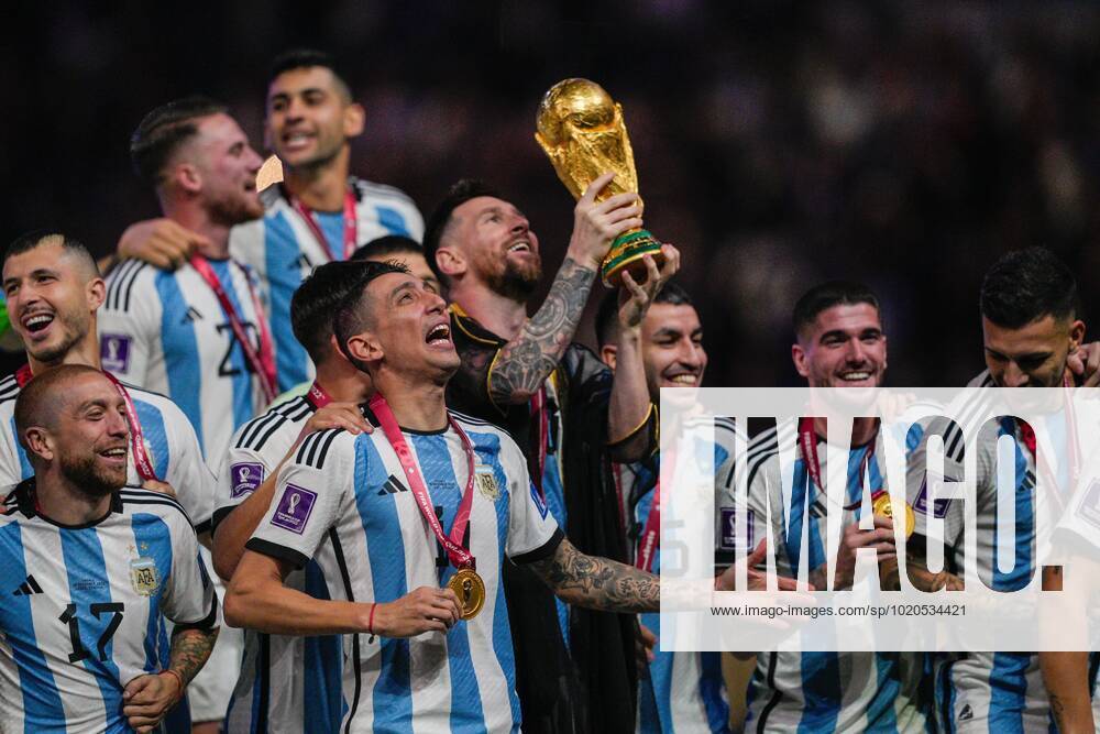 Mandatory Credit: Photo by Dave Shopland Shutterstock (13670813dm) Angel Di Maria of Argentina looks to the sky as he celebrates alongside Lionel Messi of Argentina lifting the FIFA World Cup, WM, Weltmeisterschaft, Fussball trophy Argentina v France, FIFA World Cup 2022, Final, Football, Lusail Stadium, Al Daayen, Qatar - 18 Dec 2022 Editorial Use Only Argentina v France, FIFA World Cup 2022, Final, Football, Lusail Stadium, Al Daayen, Qatar - 18 Dec 2022 Editorial Use Only