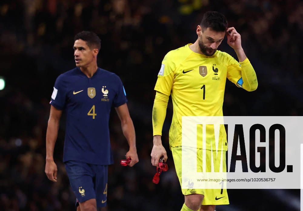 Doha, Qatar, 18th December 2022. Raphael Varane of France and Hugo Lloris of France dejected as they collect their losers medals during the FIFA World Cup, WM, Weltmeisterschaft, Fussball 2022 match at Lusail Stadium, Doha. Picture credit should read: David Klein Sportimage . SPI-2101-0230
