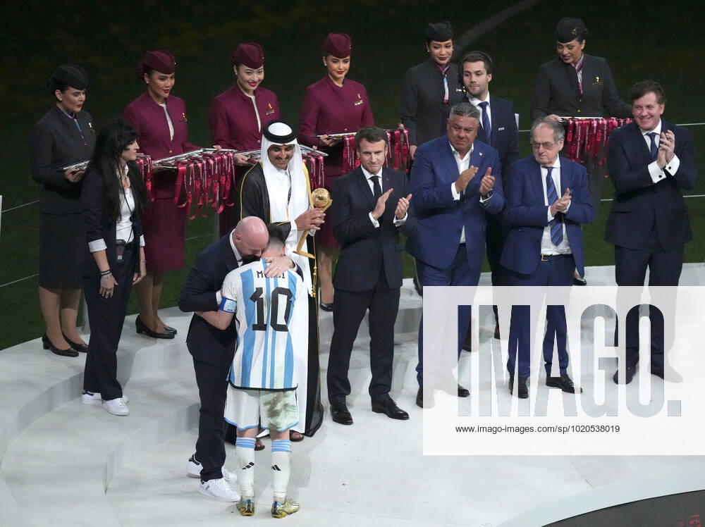 (221218) -- LUSAIL, Dec. 18, 2022 -- FIFA President Gianni Infantino hugs Lionel Messi (front) of Argentina during the awarding ceremony of the 2022 FIFA World Cup, WM, Weltmeisterschaft, Fussball at Lusail Stadium in Lusail, Qatar, Dec. 18, 2022. ) (SP)QATAR-LUSAIL-2022 WORLD CUP-FINAL-ARG VS FRA PanxYulong